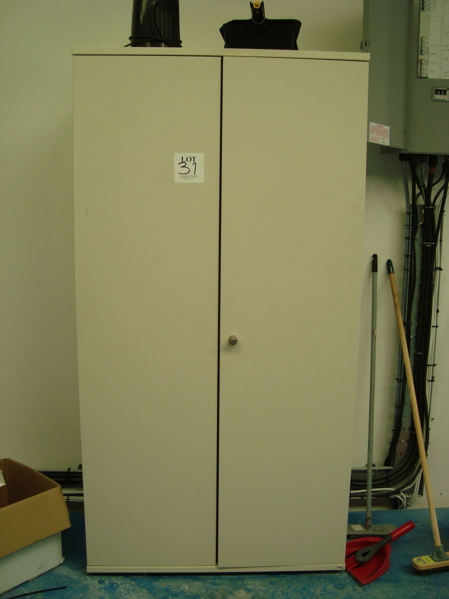 A steel double door storage cupboard