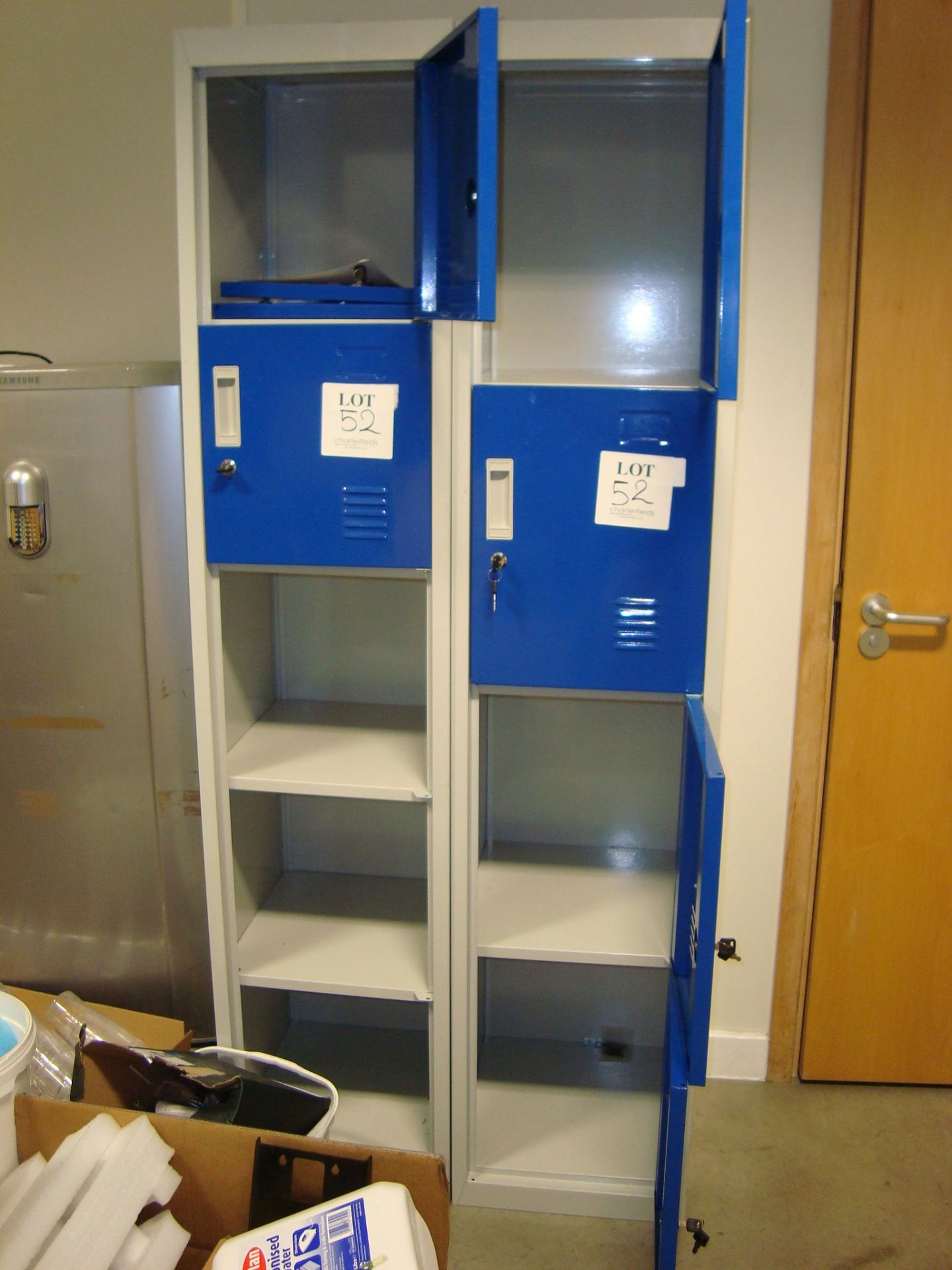 Two steel four drawer filing cabinets, with contents and two four door clothes lockers, as lotted