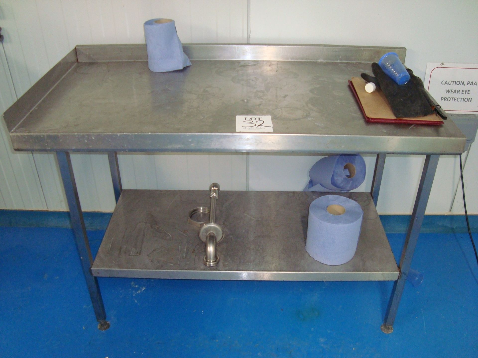 A stainless steel catering preparation table