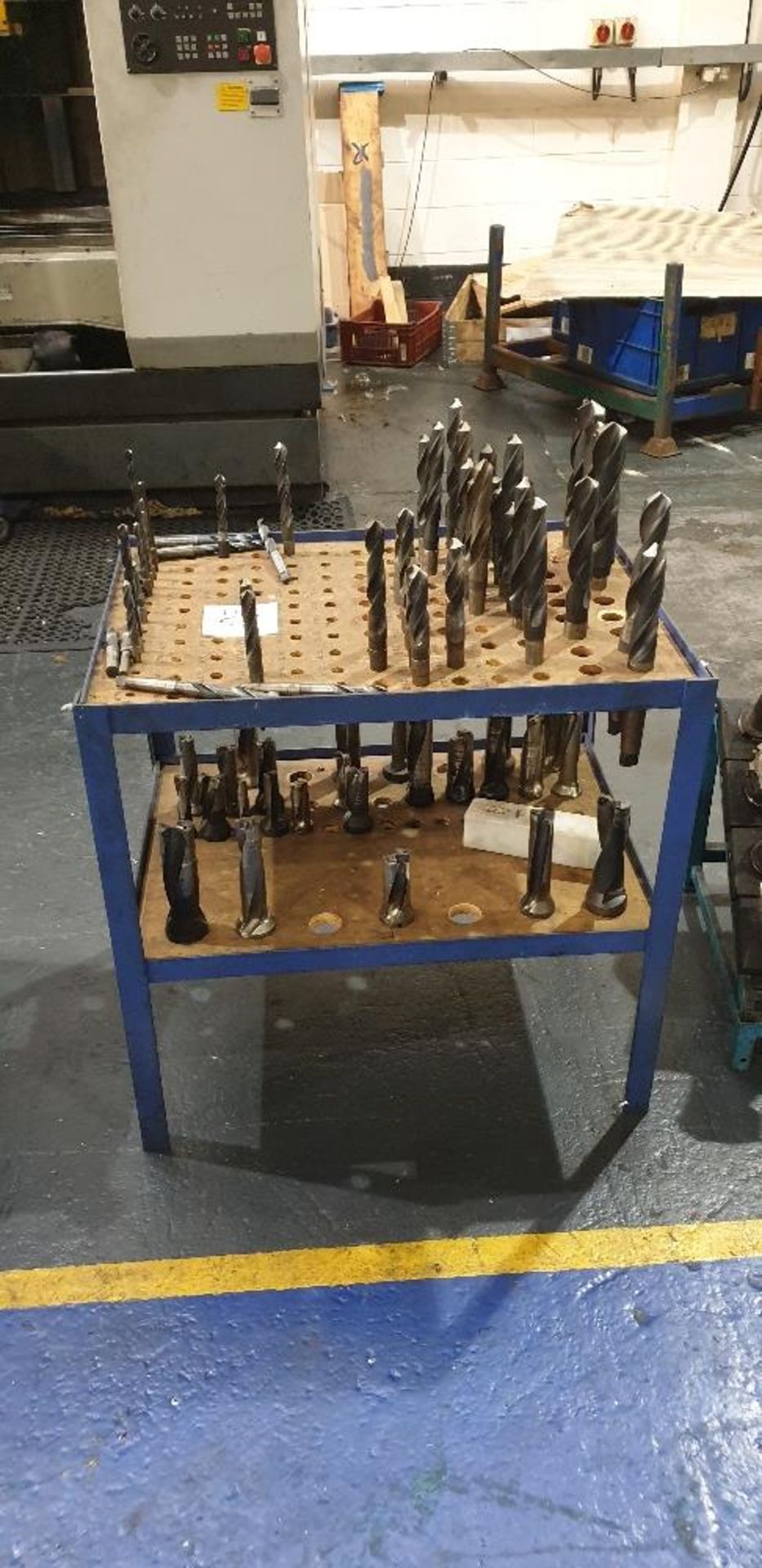 Two tier stand with various Morse taper drills and straight shank cutters