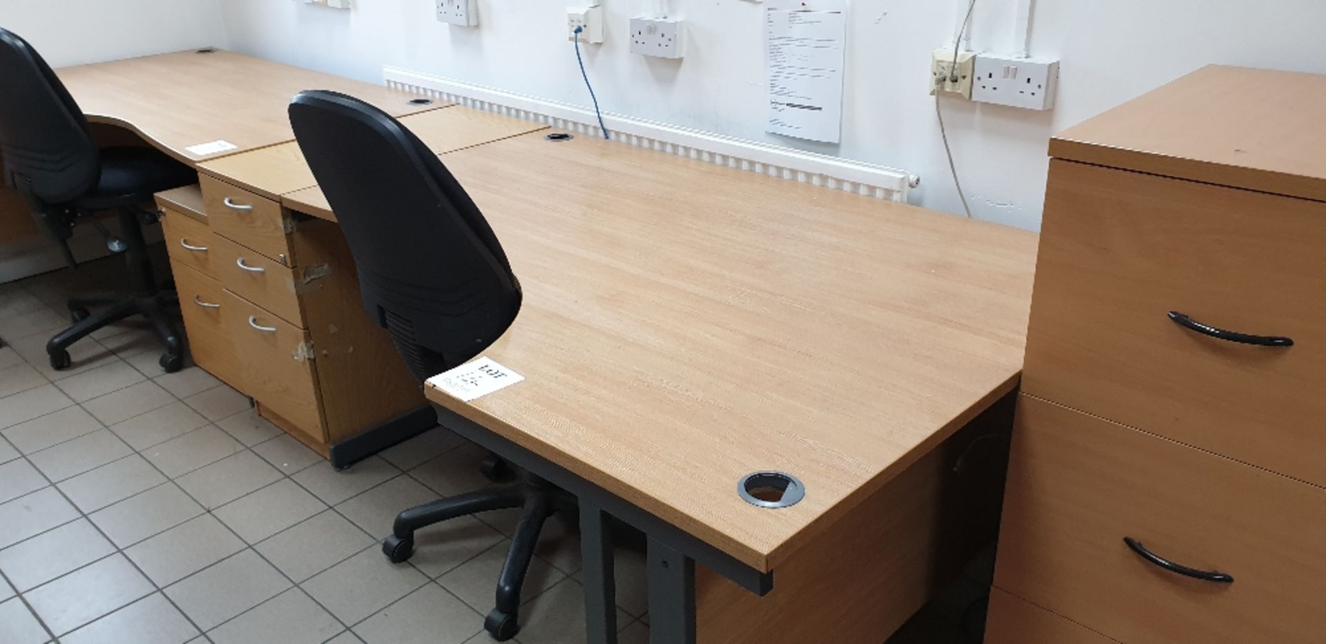 Curved desk with swivel chair and three drawer desk pedestal