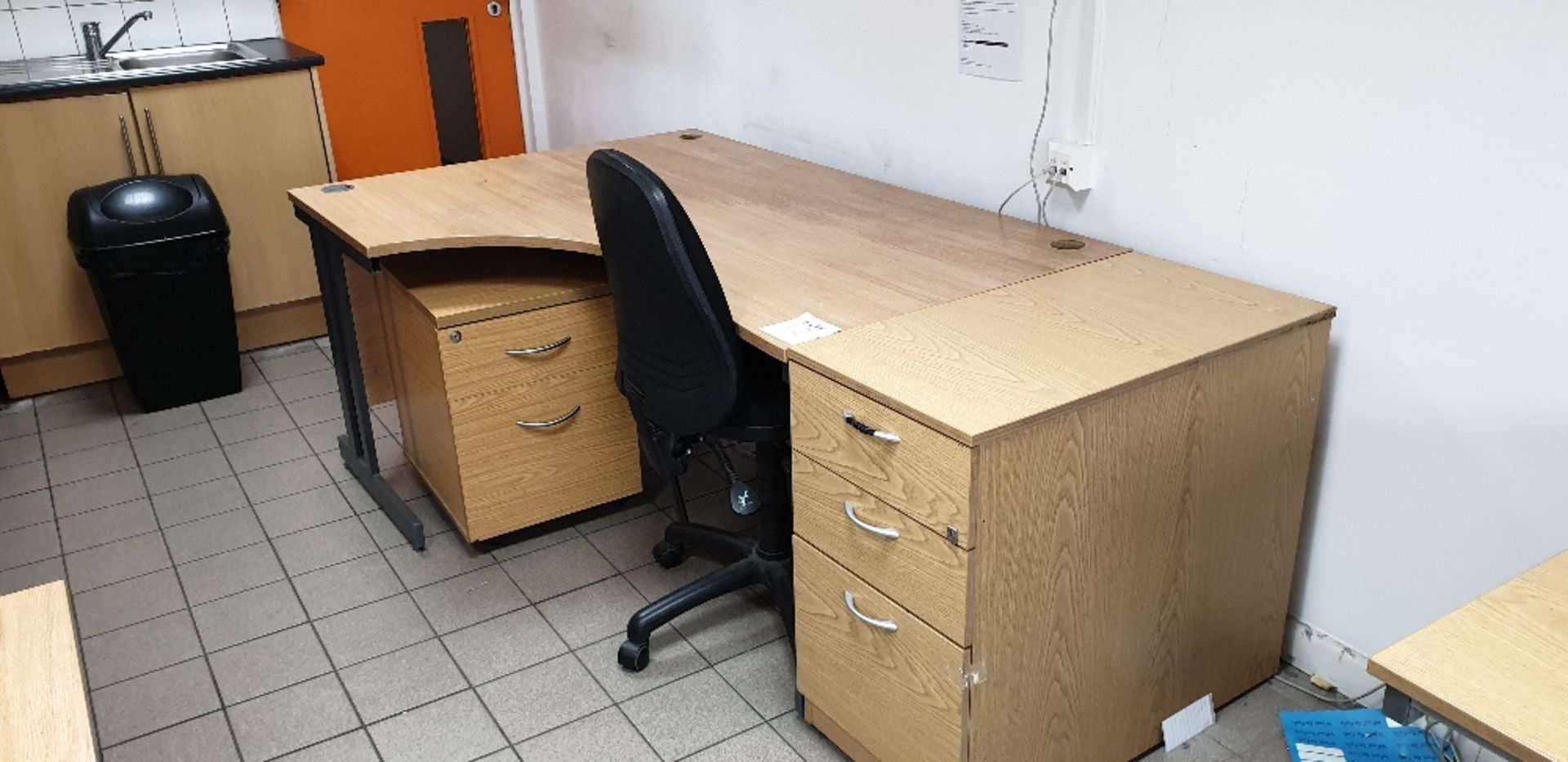 Curved desk with three drawers and two drawer desk pedestals and swivel chair