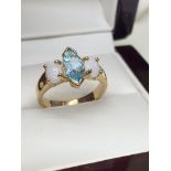 MARQUIS BLUE TOPAZ & OPAL RING SET IN YELLOW METAL TESTED AS 18ct GOLD