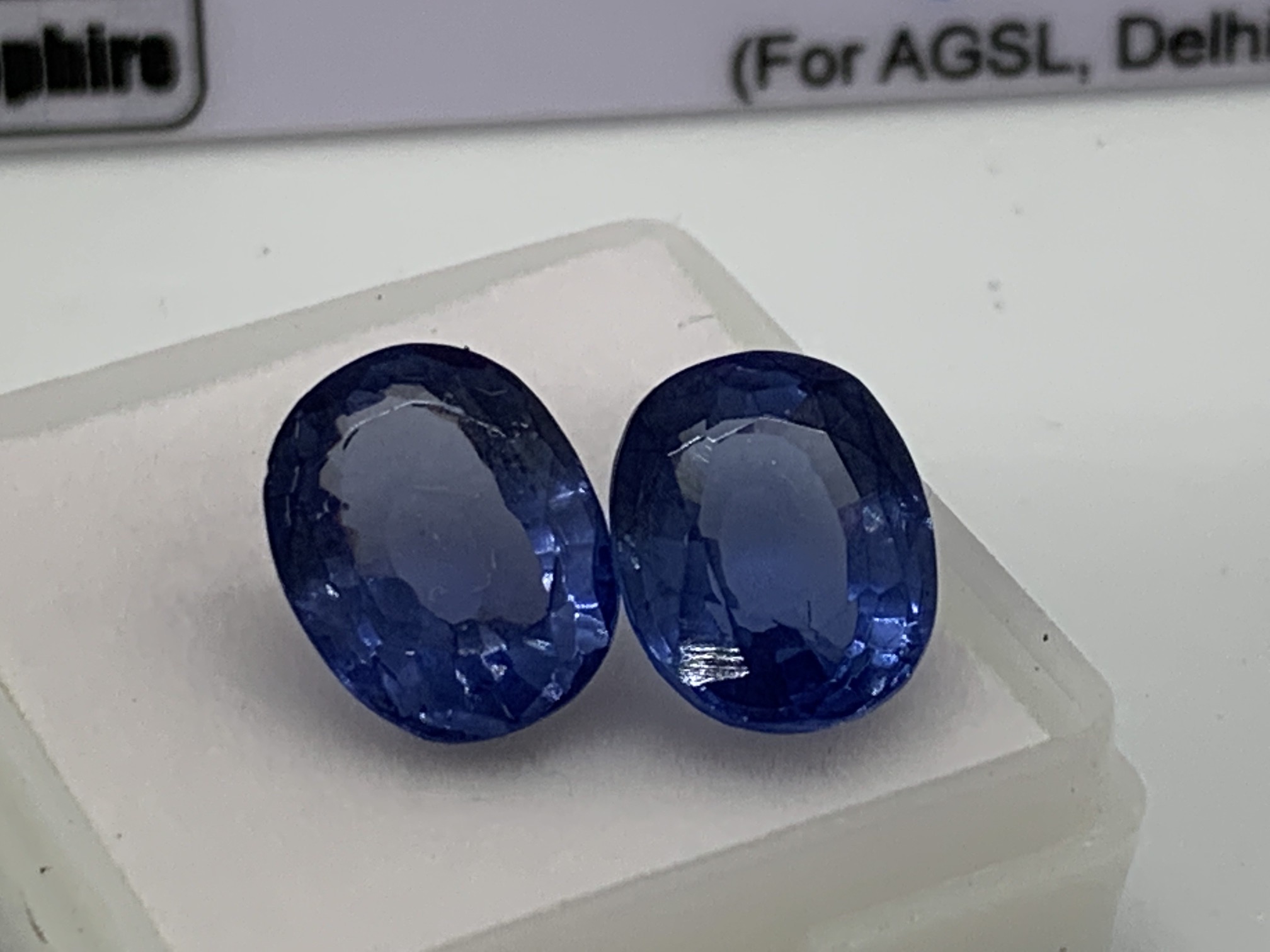 2 X BLUE STONE WITH CARD MARKED SAPPHIRE