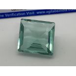 GREEN STONE WITH CARD MARKED TOPAZ - 40ct+