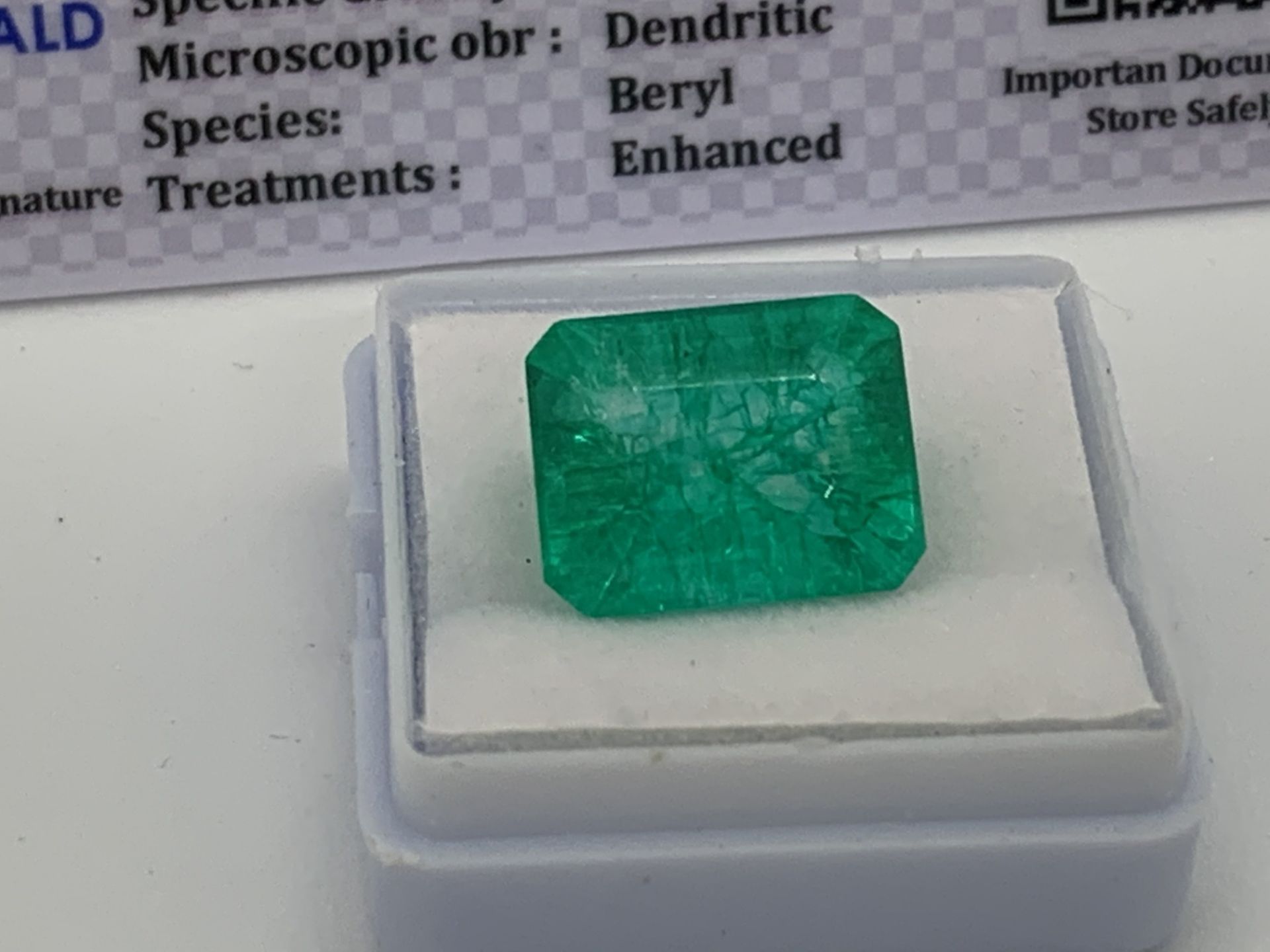 GREEN STONE WITH CARD MARKED EMERALD