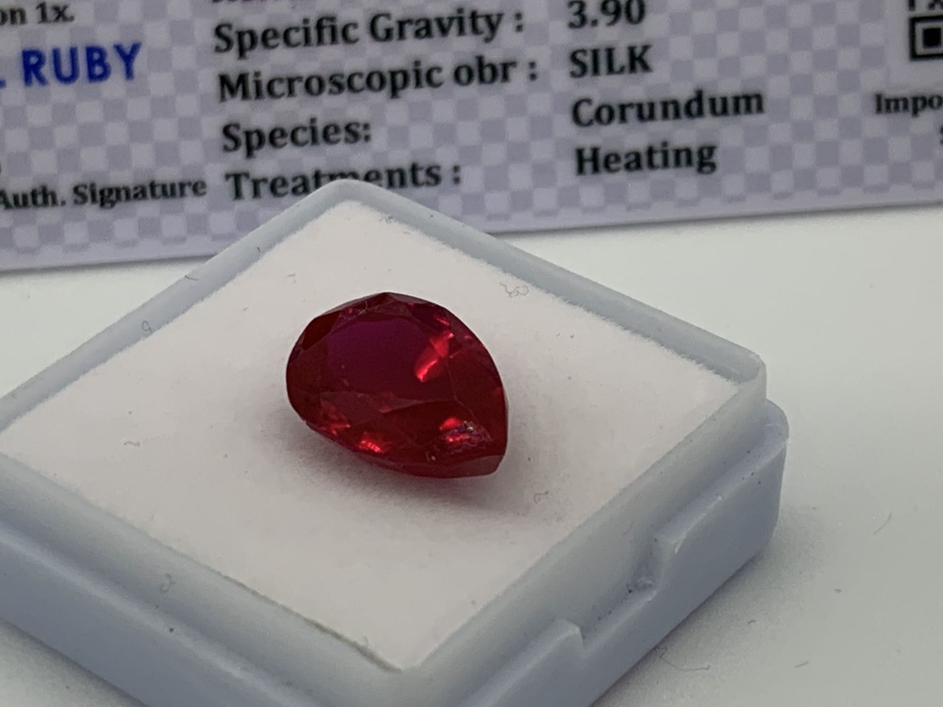 RED STONE WITH CARD MARKED RUBY