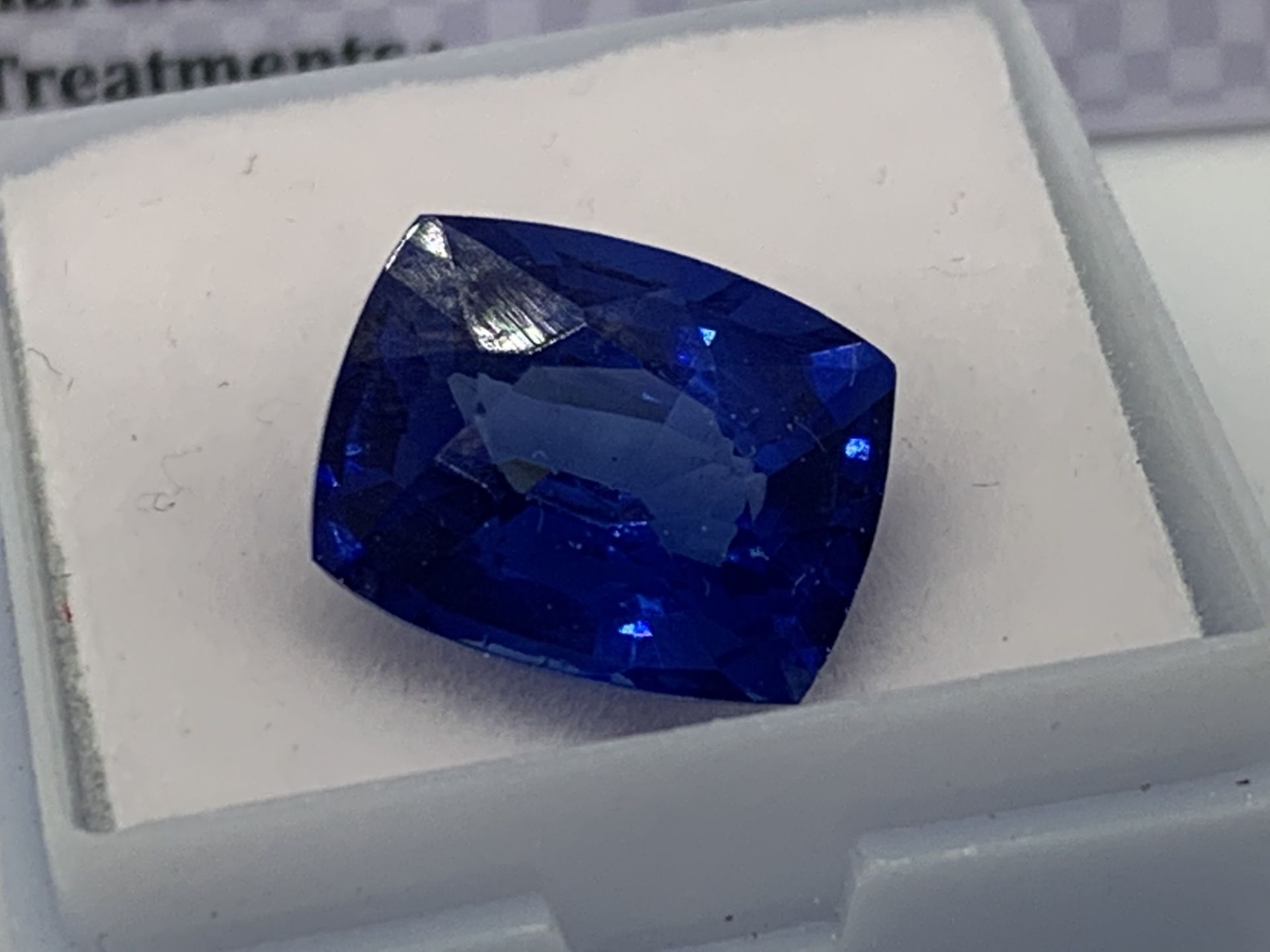 BLUE STONE WITH CARD MARKED SAPPHIRE