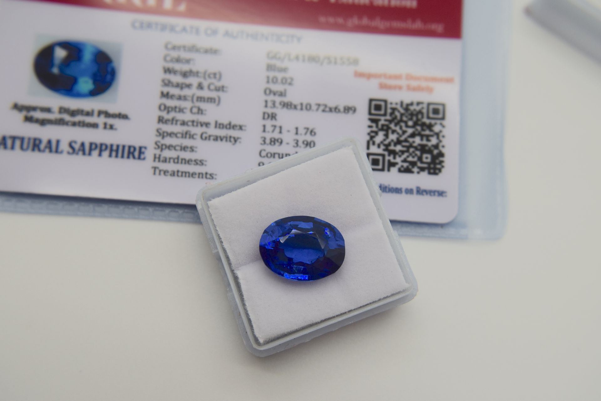 BLUE STONE WITH CARD MARKED BLUE NATURAL SAPPHIRE