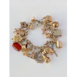 Beautiful Heavy Vintage 9ct Gold Charm Bracelet with 19 Charms - Weighs 62.2 Grams Approx