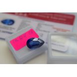 BLUE STONE WITH CARD MARKED BLUE NATURAL SAPPHIRE