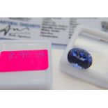 BLUE STONE WITH CARD MARKED BLUE NATURAL TANZANITE