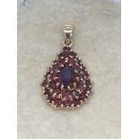 18ct GOLD GARNET SET PENDANT