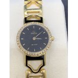 18 carat gold Omega watch set with Diamond bezel