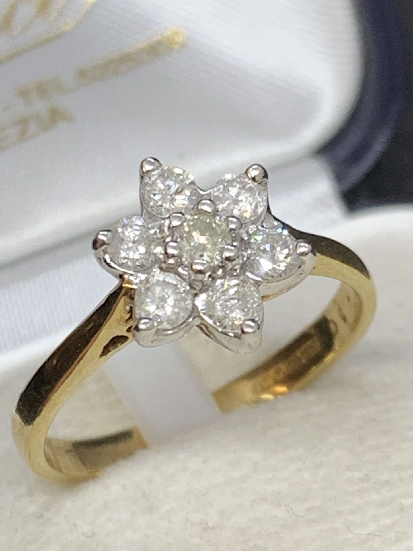 9 carat gold diamond Daisy ring approximately 0.5 carats of diamonds