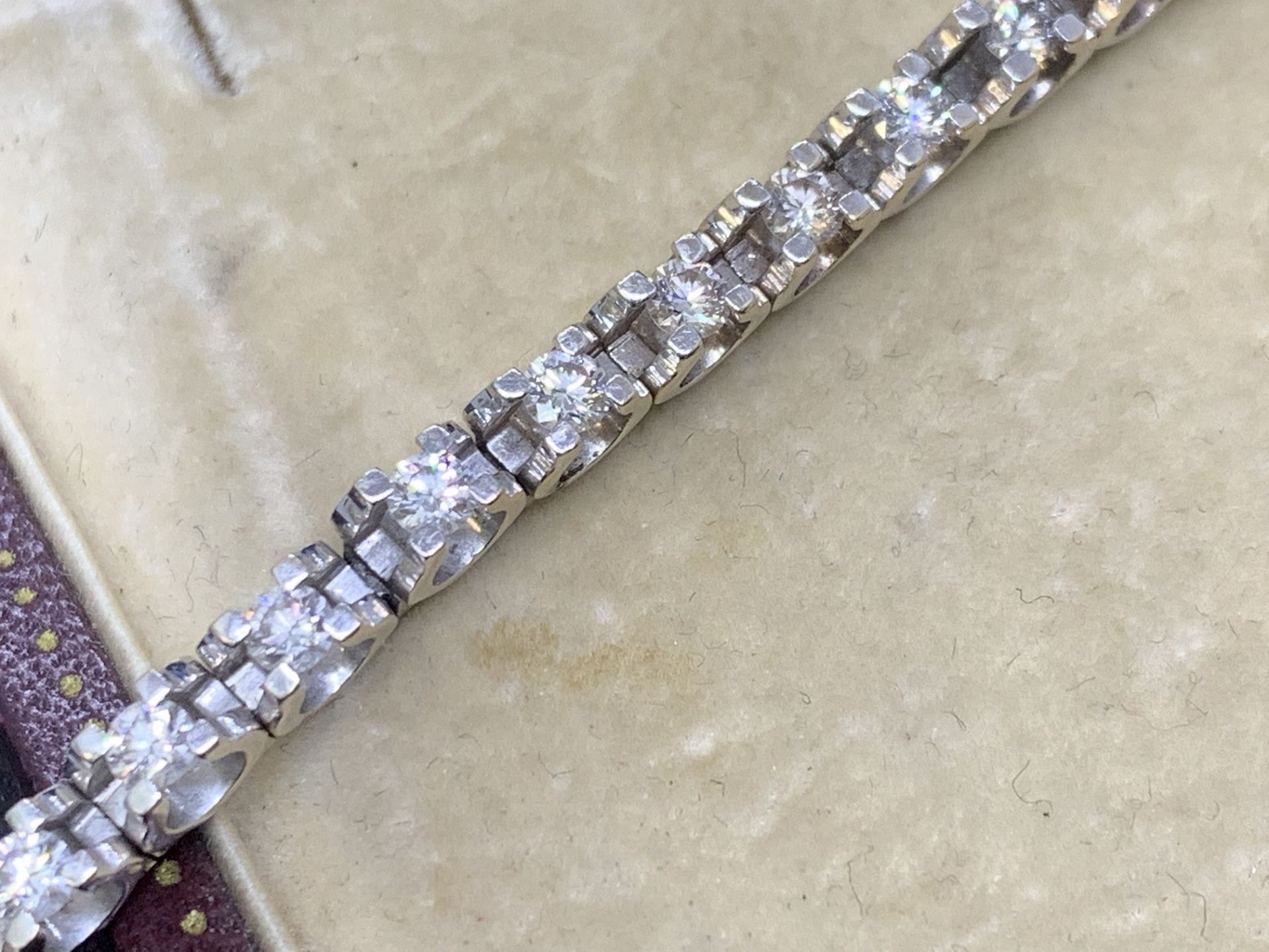 18 carat white gold tension Set diamond bracelet approximately 3.00cts of G colour VS diamonds