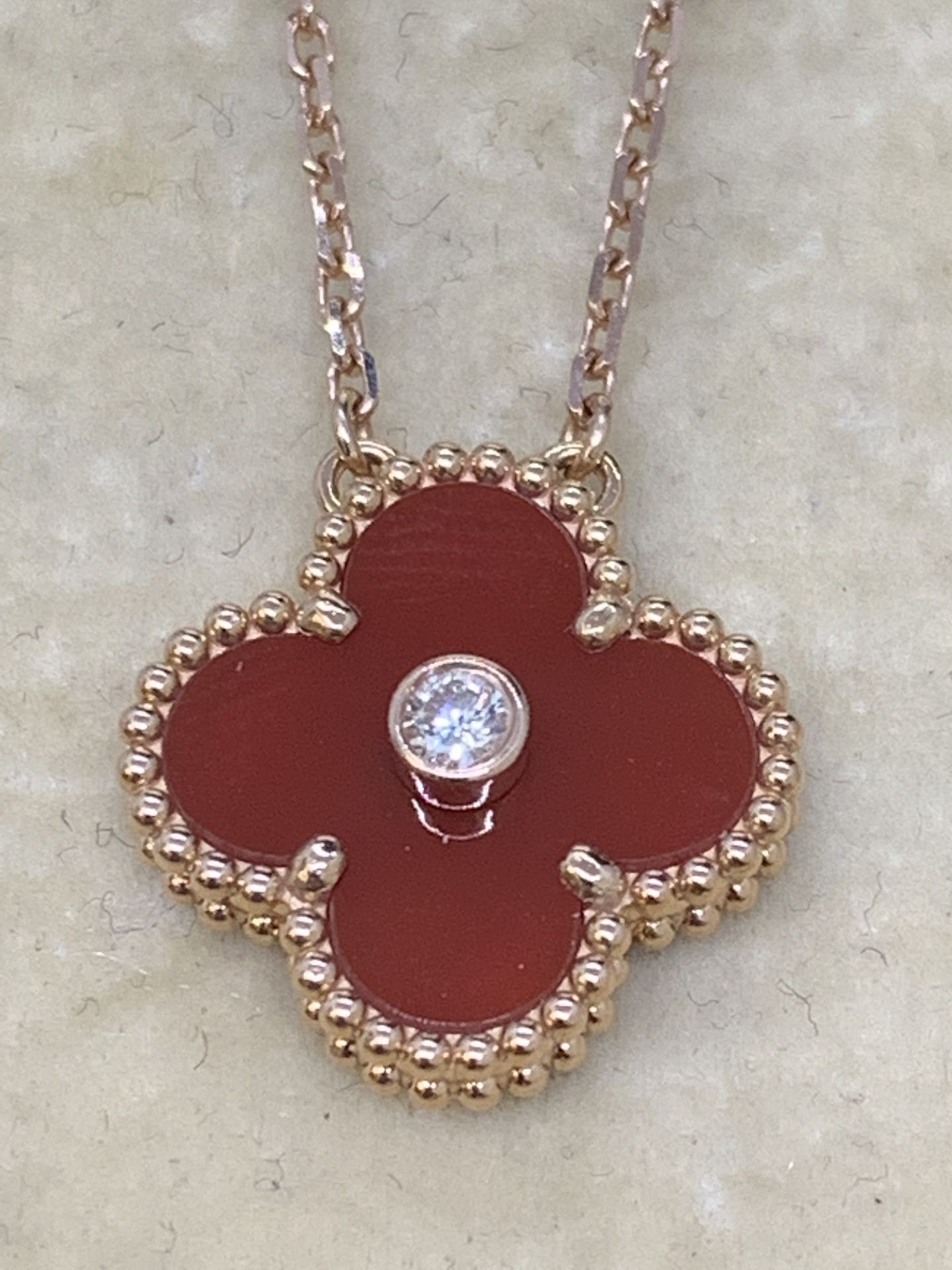 18 carat rose gold Diamond set pendant and chain marked VCA 750