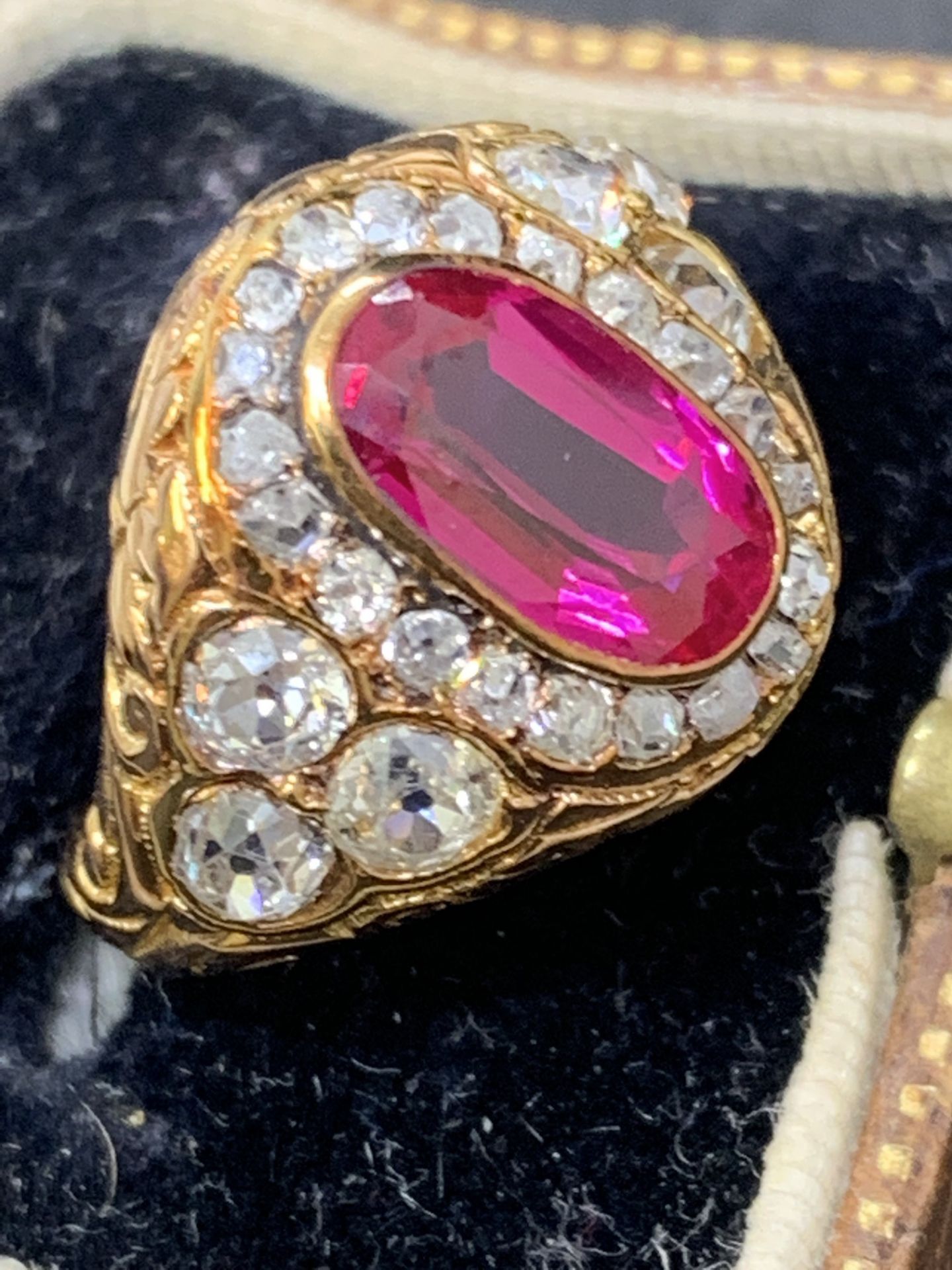 Vintage 18 carat gold ring set with ruby type stone & 1.3 carats of old mine cut diamonds