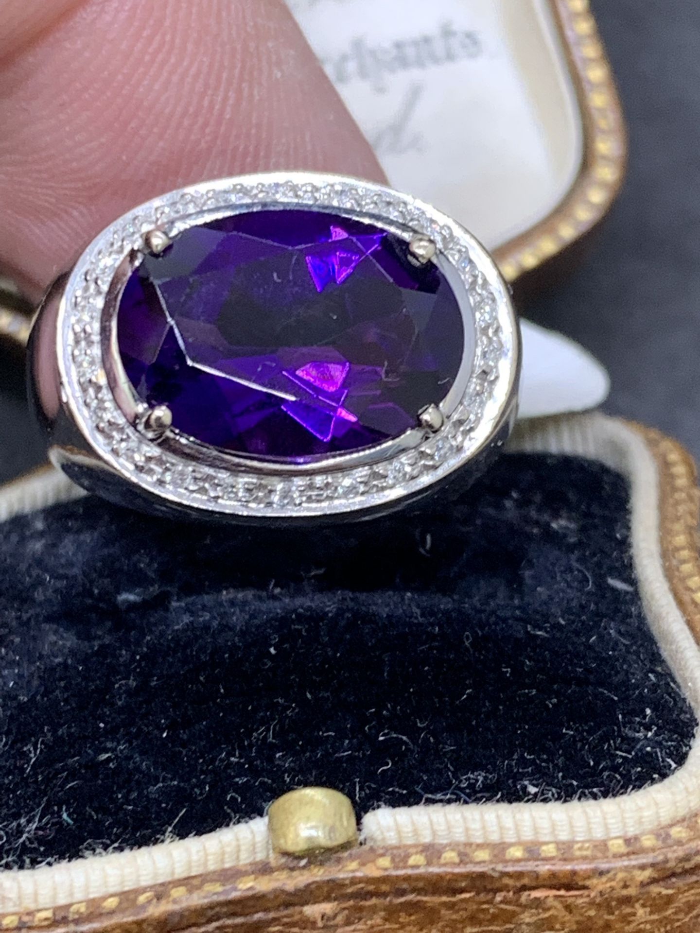 18 carat gold ring set with approximately 6 carat amethyst with diamonds approximately 9 g