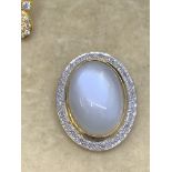 9 carat gold moon stone set diamond pendant approximately 0.5 carats of diamonds 6.1 g