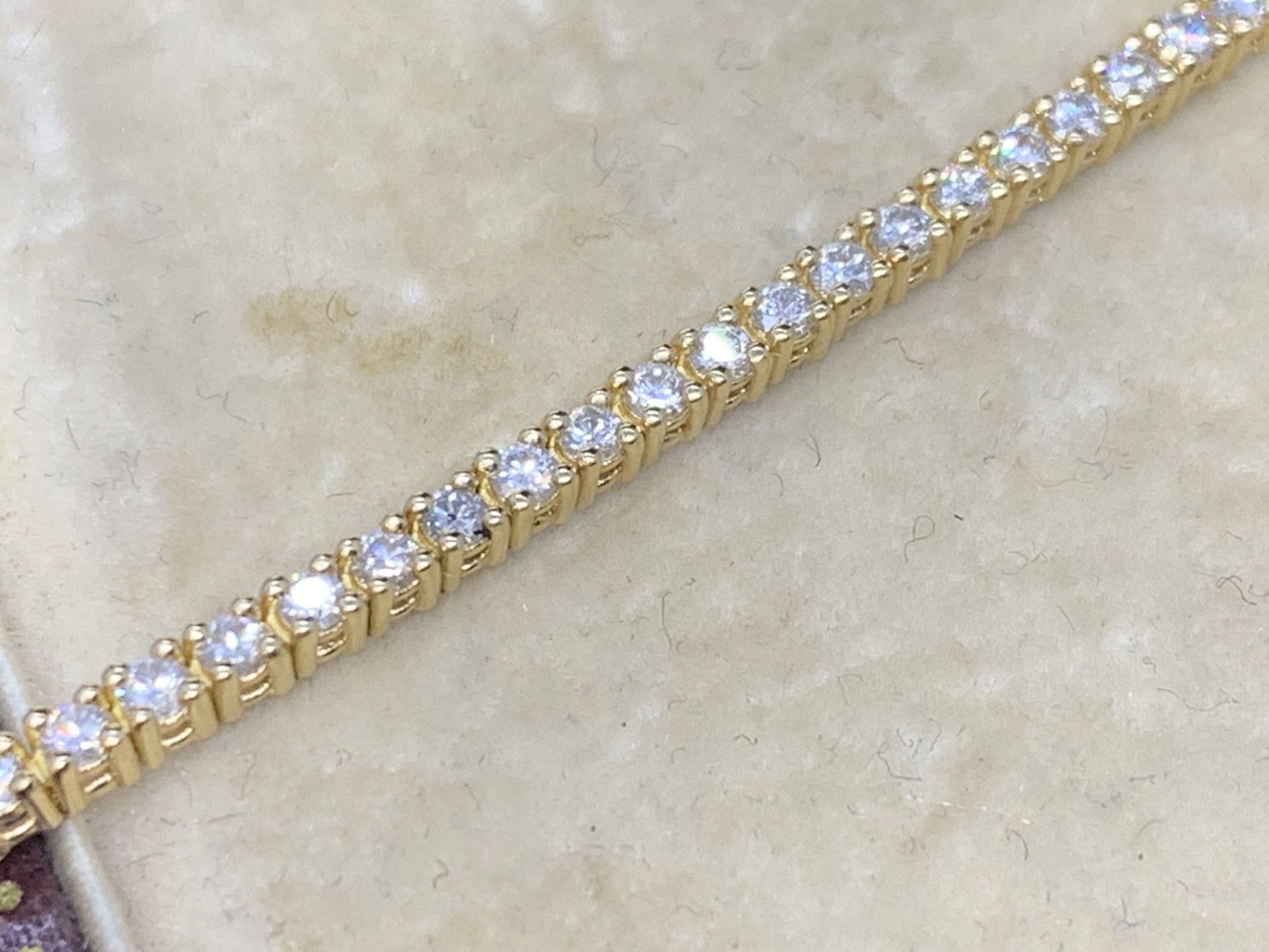 18 carat yellow gold diamond tennis bracelet approximately 2.24 carats G colour VS clarity