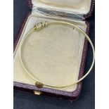 14 carat gold bangle set with small gold rings approximately 14 g