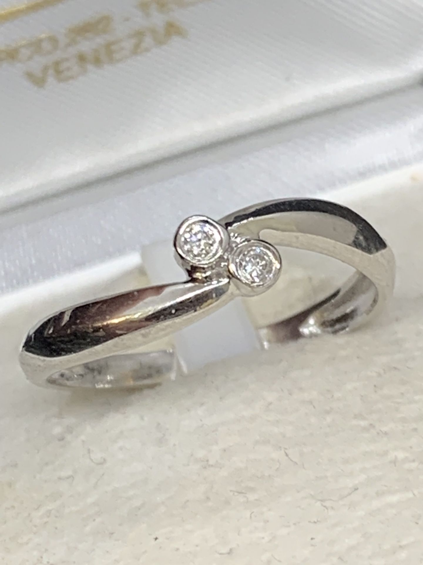 18 carat white gold ring set with two diamonds