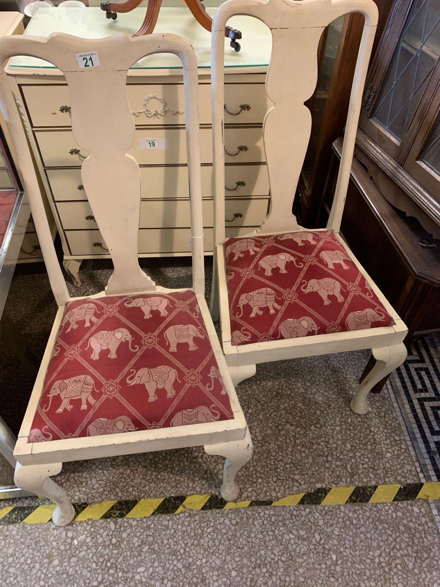 Pair of old dining chairs been painted upholstered seats with elephant pattern