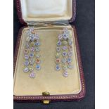 Exquisite diamond and multi Gem set chandelier style drop earrings set in white metal tested as 18