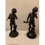 Pair of bronzes Boys depicting flute player and other