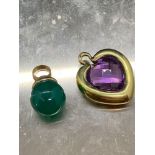 Two stone set pendants heart shaped pendant tested at 18 carat gold and other pendant tested as 9