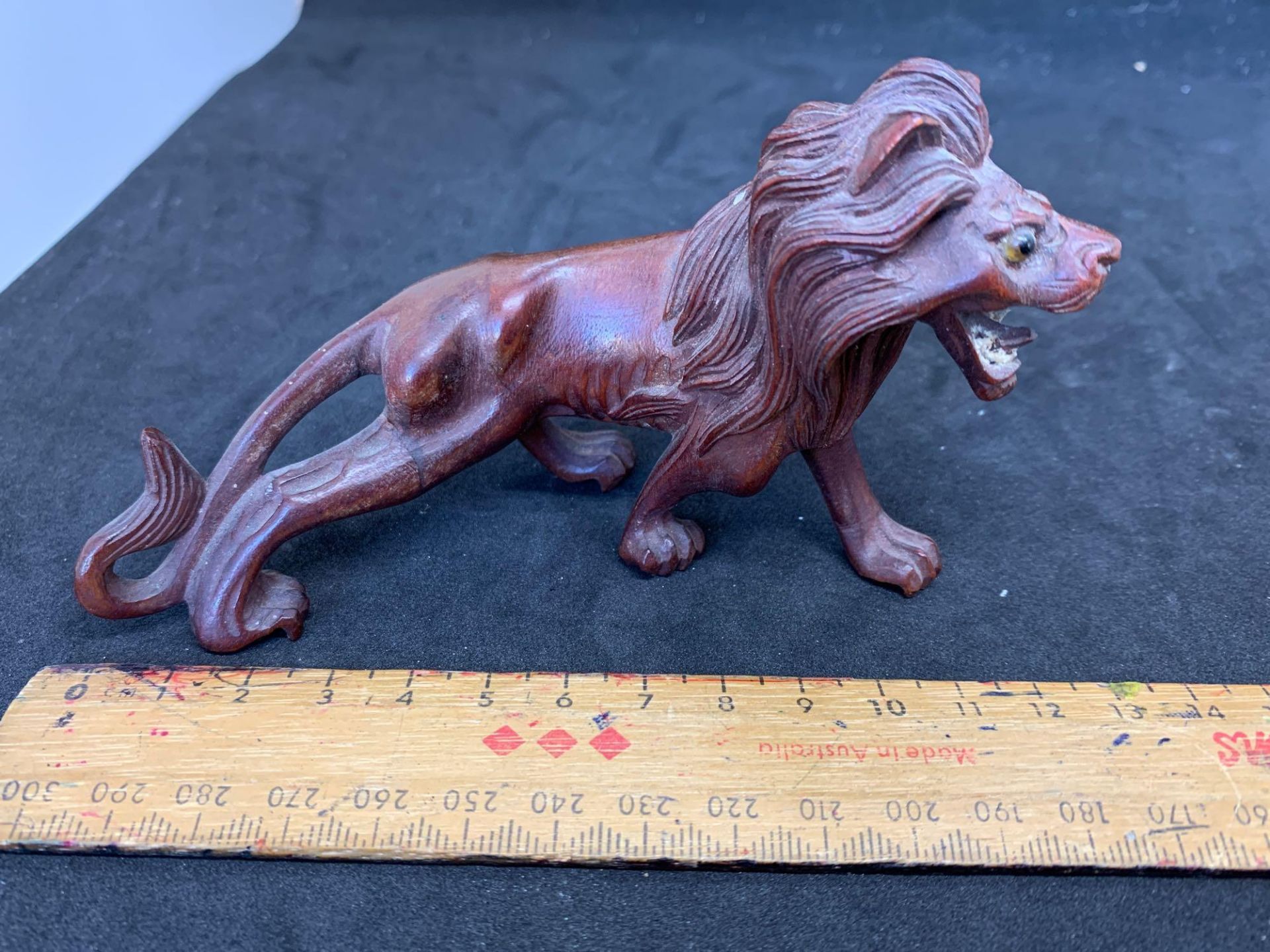 Carved Lion with repaired leg/tail