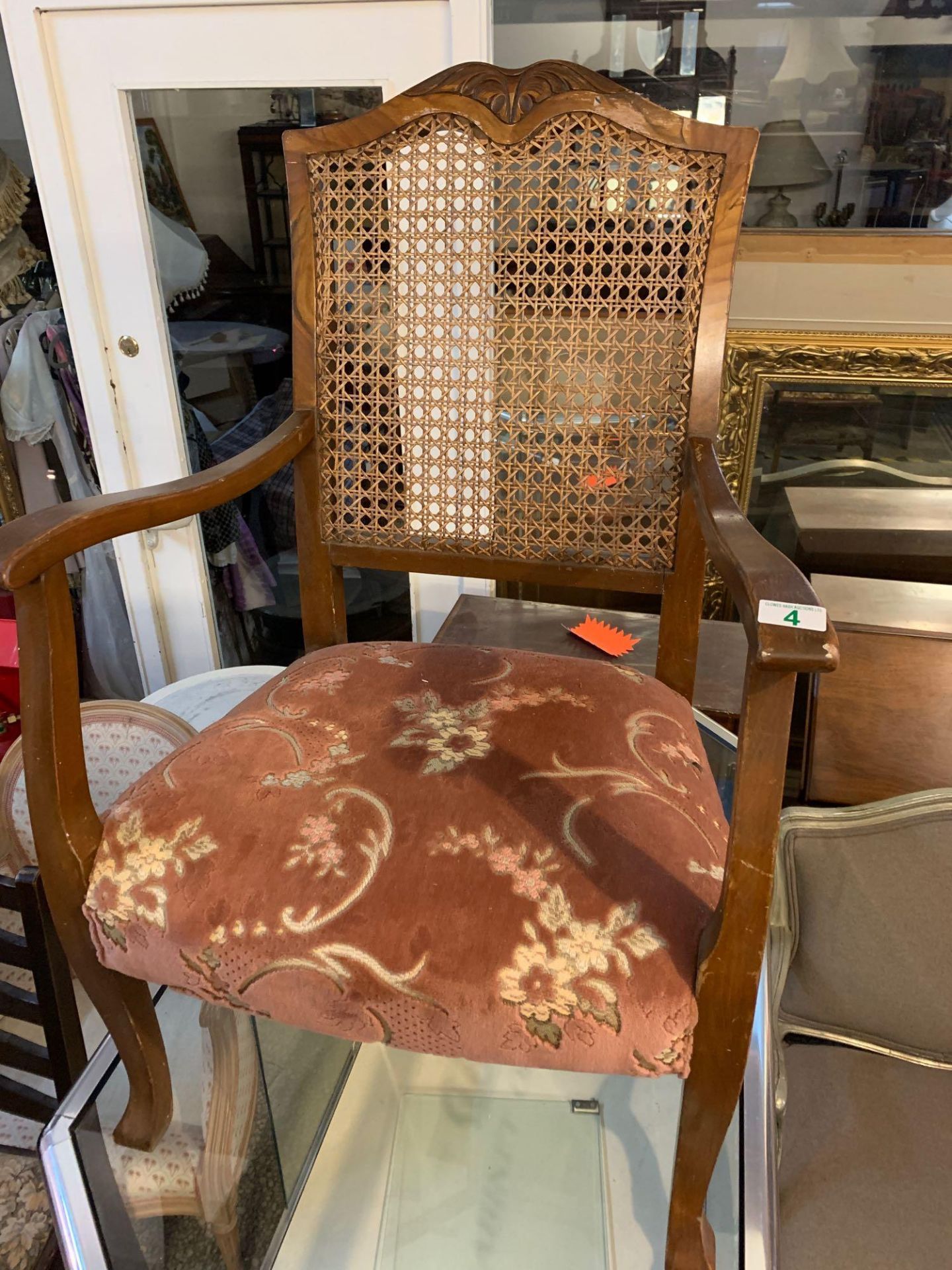 Upholstered Carver chair back a small hole in wickerwork