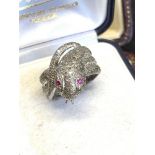 Diamonds and rubies set snake triple ring set in white metal tested as 18 carat gold approximately