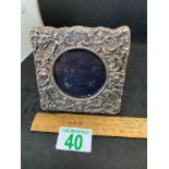 Silver coloured frame to depicting cherubs