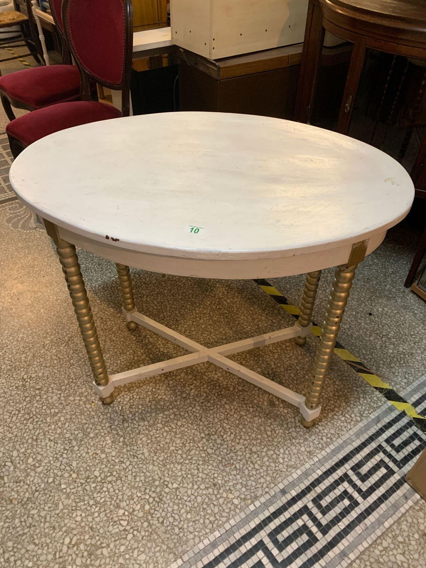 White and gold painted oval table