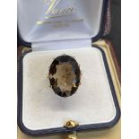 9 carat gold ring set with smoky quartz approximately a size M weighs approximately 7.5 g