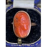 9 carat gold carved head coral set ring approximately 4.7 g