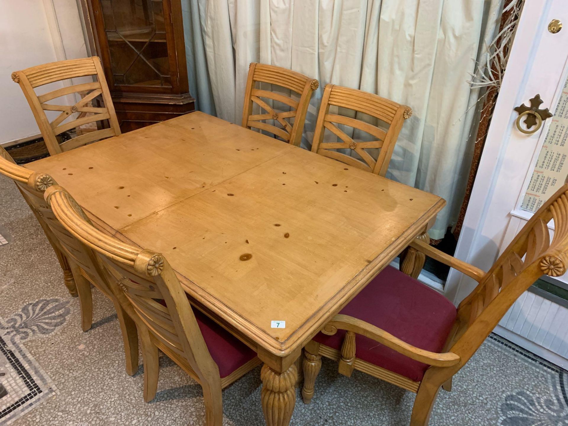 Table and six chairs consisting of two carver chairs and four matching chairs with upholstered seats