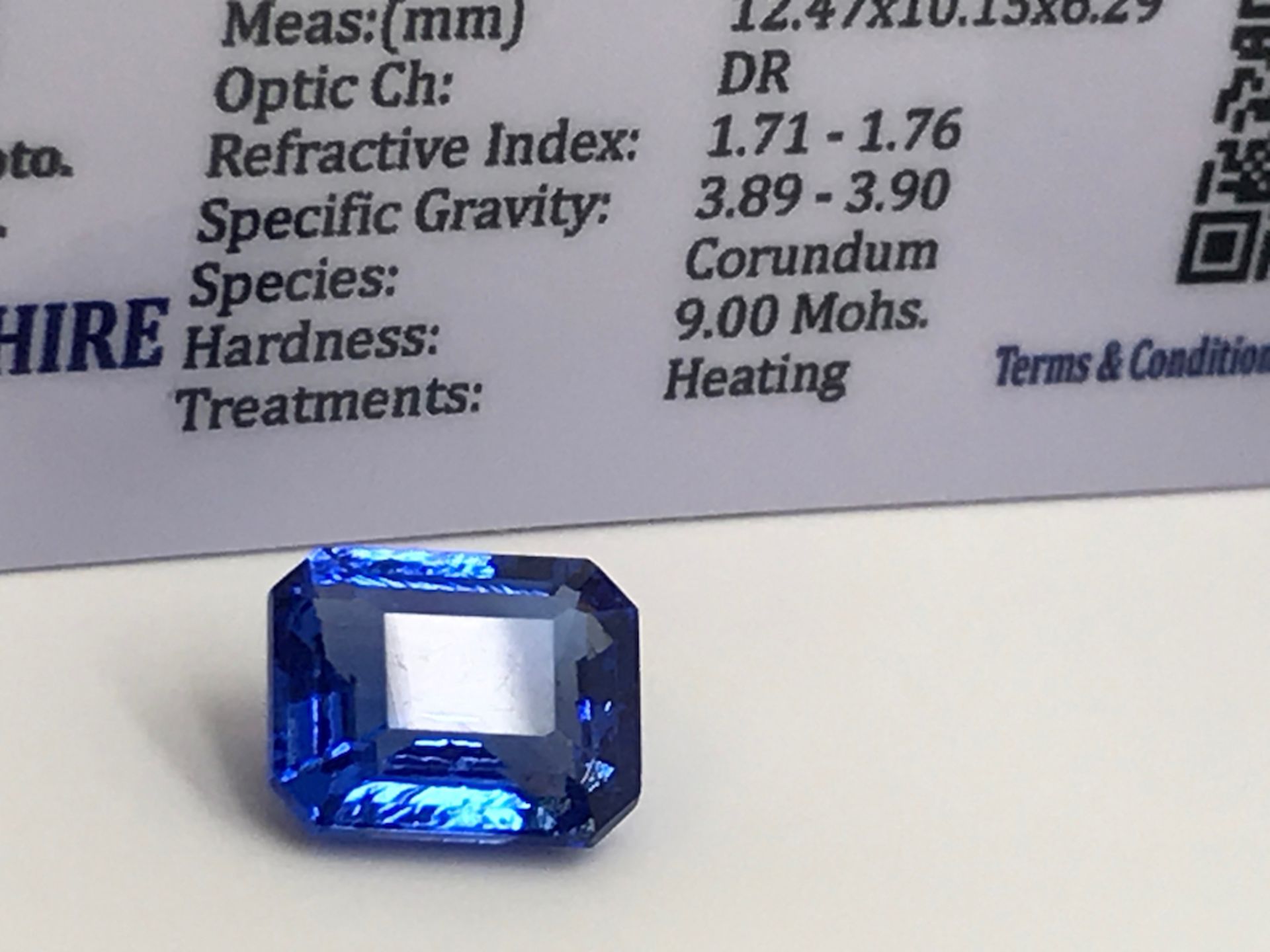 BLUE STONE WITH CARD MARKED SAPPHIRE