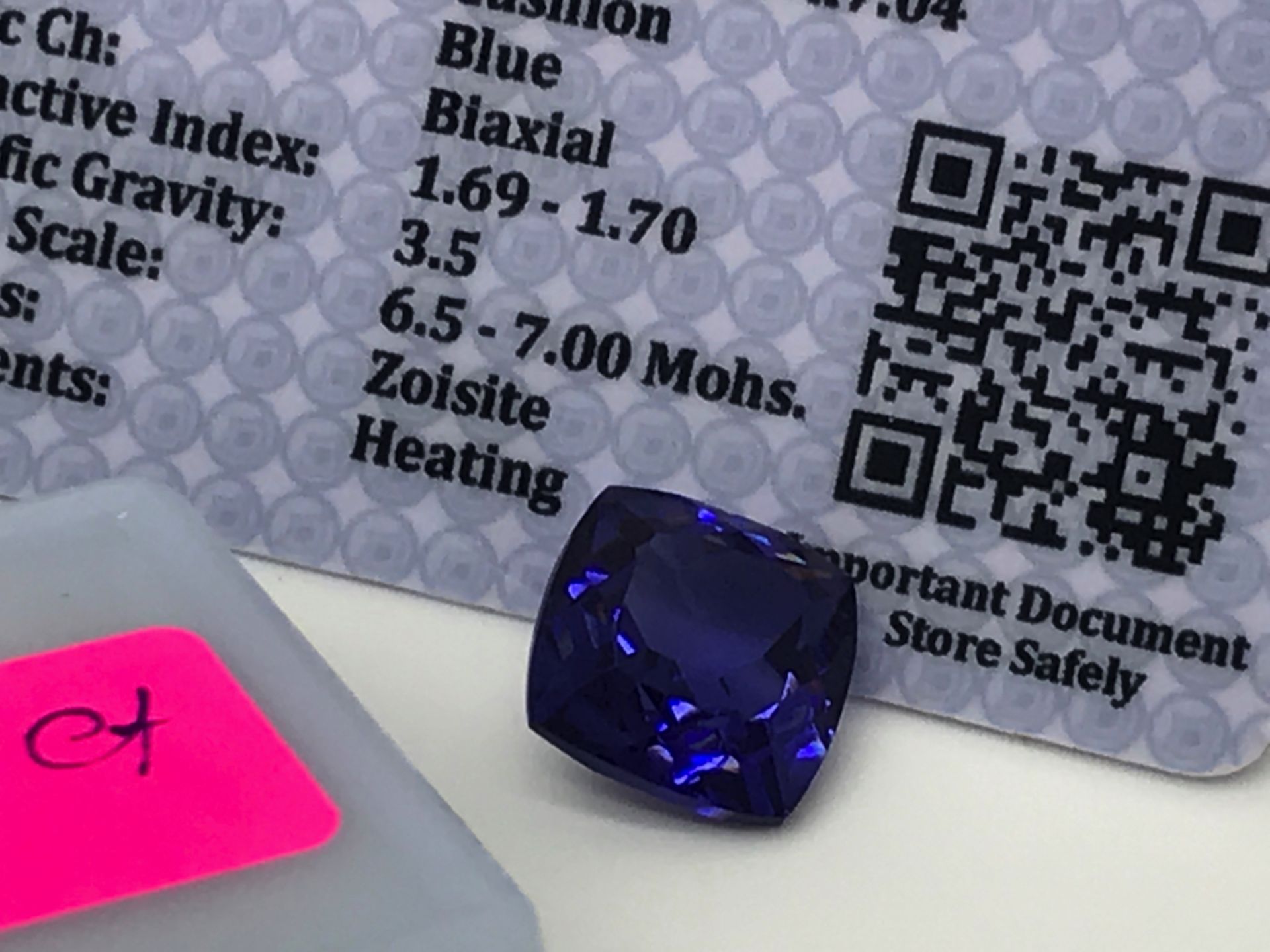 BLUE STONE WITH CARD MARKED TANZANITE