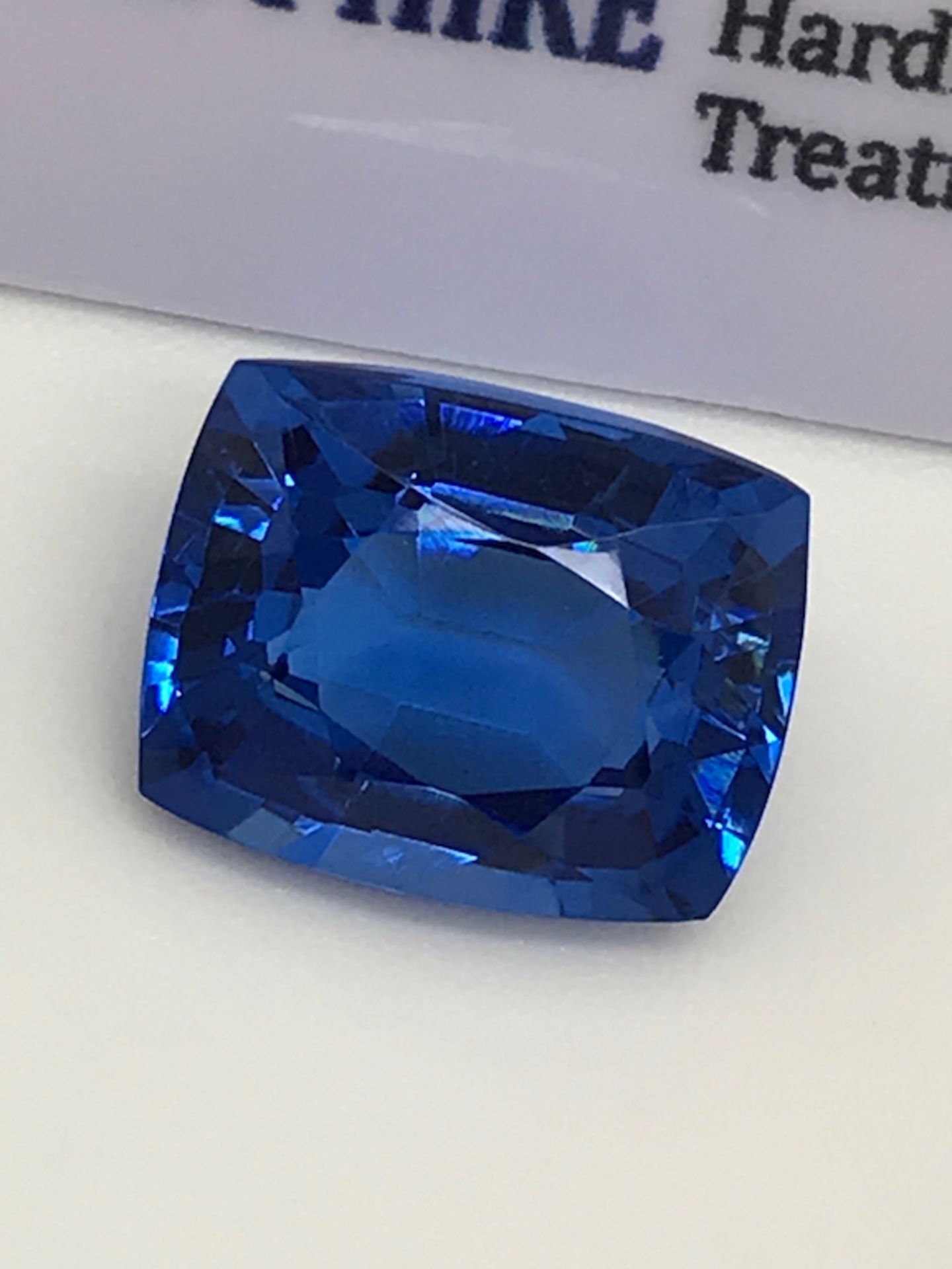 BLUE STONE WITH CARD MARKED SAPPHIRE