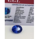 BLUE STONE WITH CARD MARKED SAPPHIRE