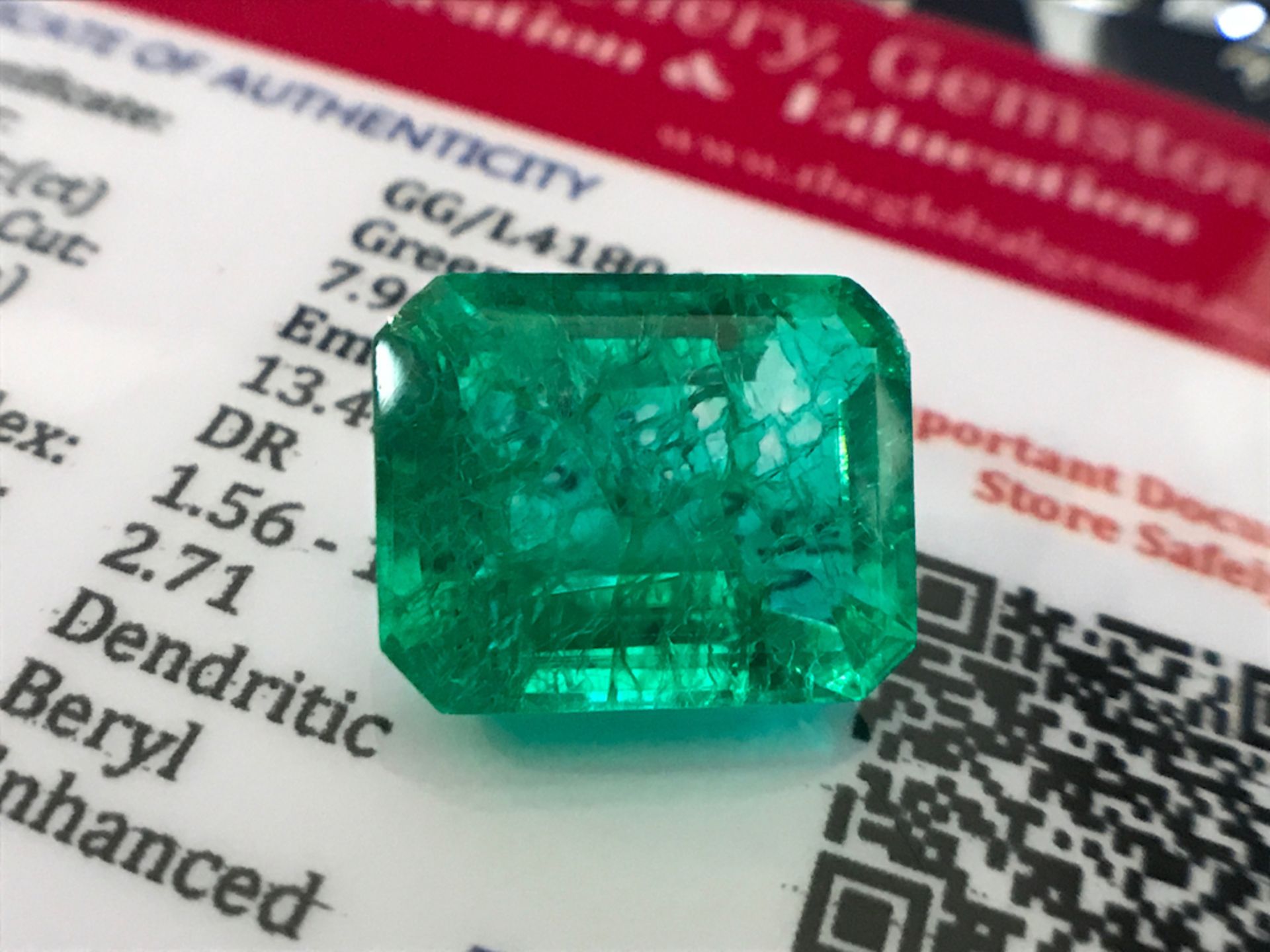 GREEN STONE WITH CARD MARKED EMERALD