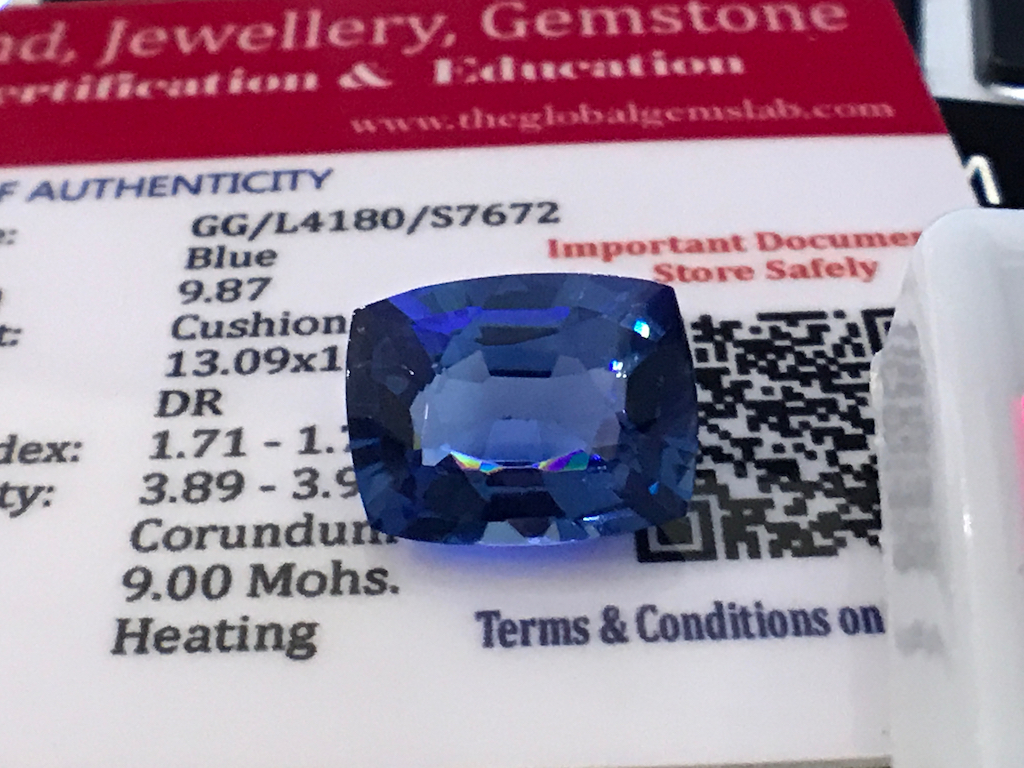 BLUE STONE WITH CARD MARKED SAPPHIRE