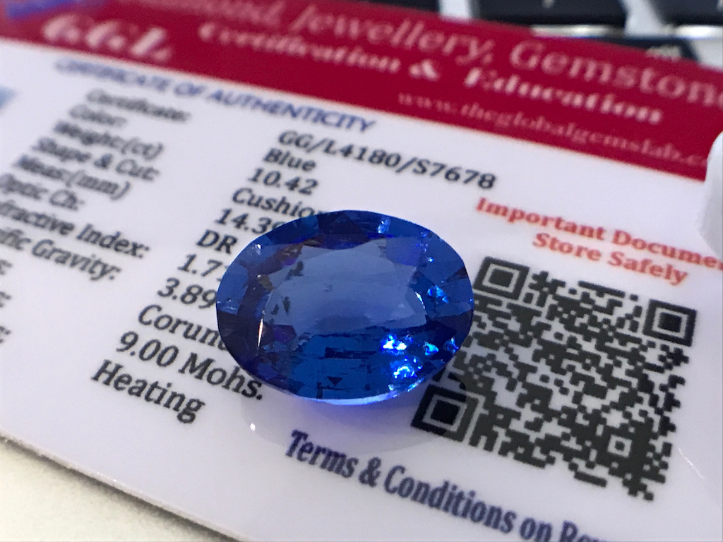 BLUE STONE WITH CARD MARKED SAPPHIRE