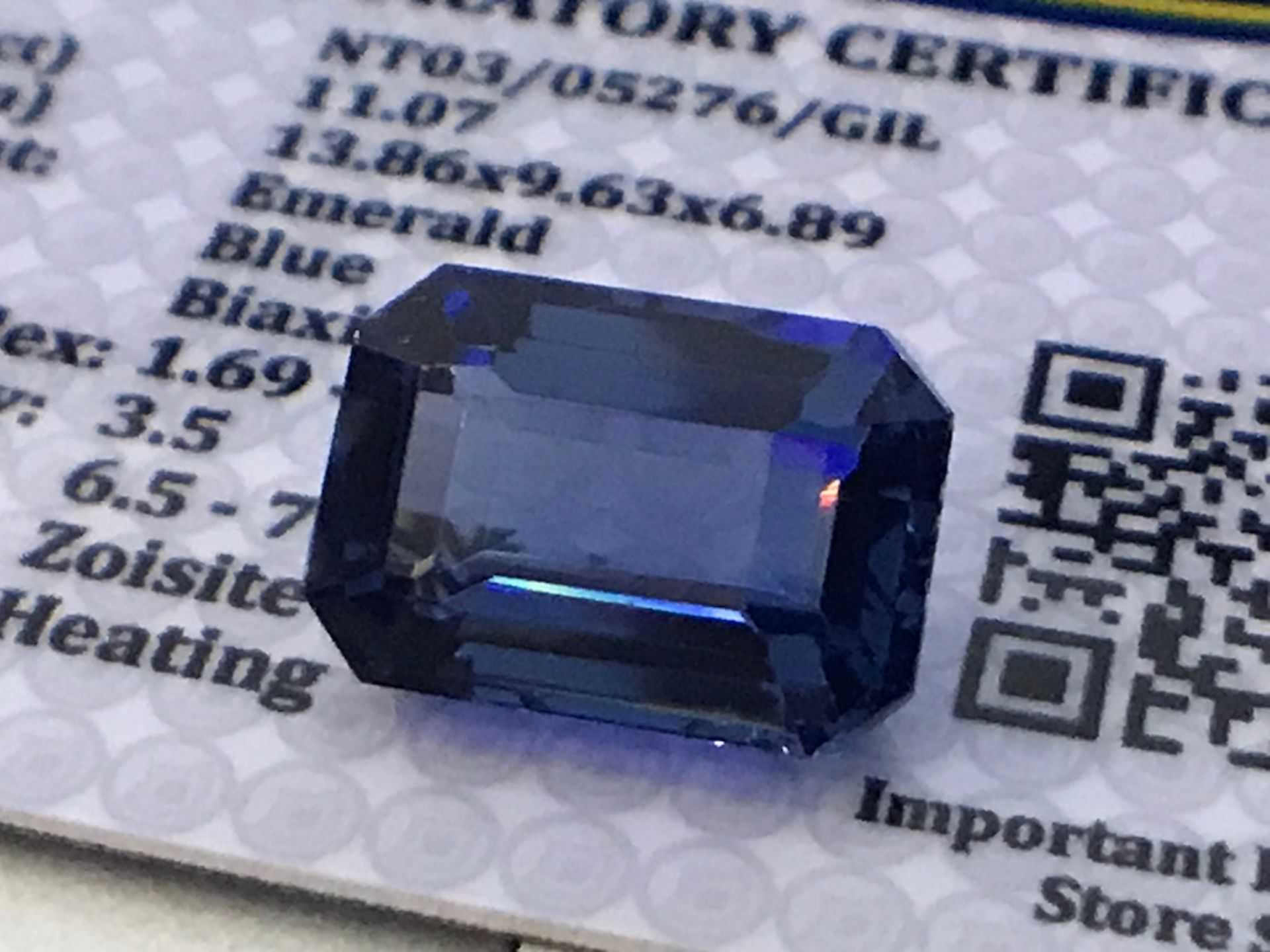 BLUE STONE WITH CARD MARKED TANZANITE