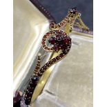 SILVER GILT GARNET SET HINGED BANGLE - 14 GRAMS