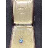 9ct GOLD BLUE TOPAZ PENDANT WITH A 18ct GOLD CHAIN