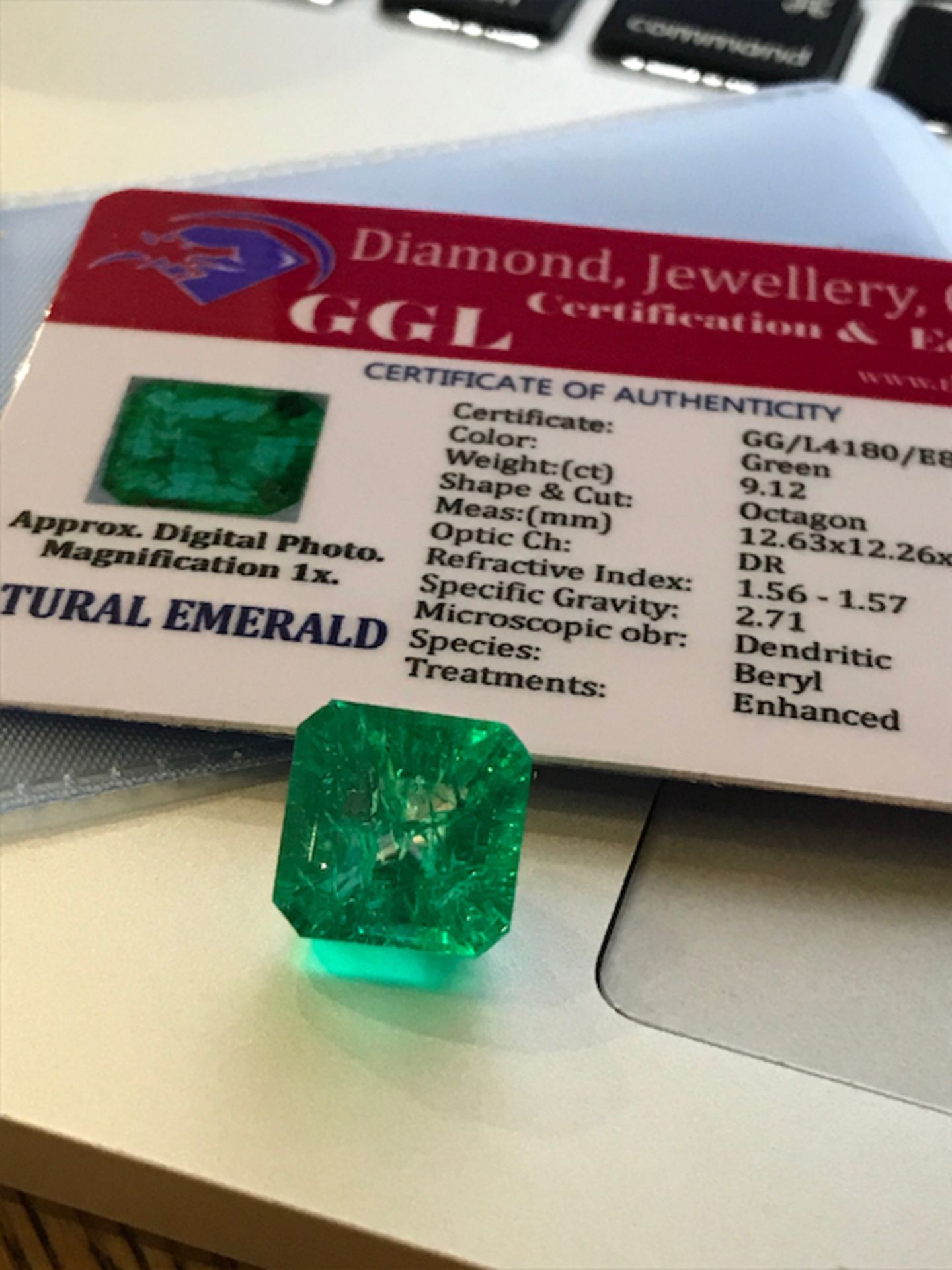 GREEN STONE WITH CARD MARKED EMERALD